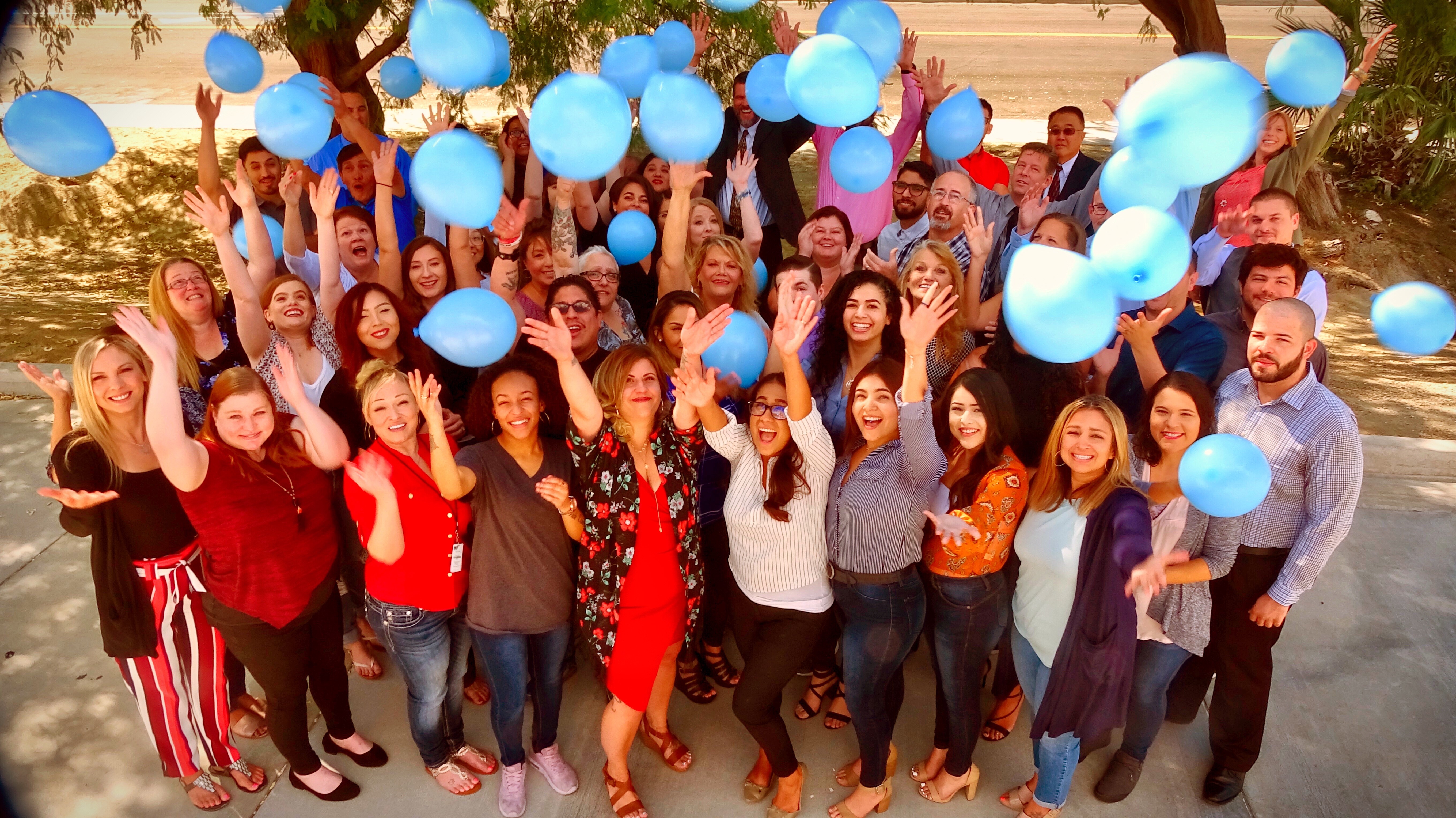 Staff members of ESP Personnel with balloons