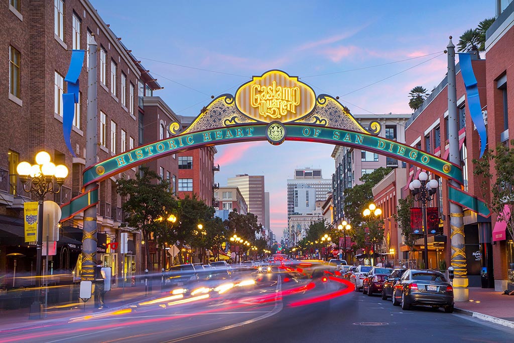Downtown San Diego Gaslamp sign over moving traffic. There are Plenty of nightlife options during your travel nurse job in California
