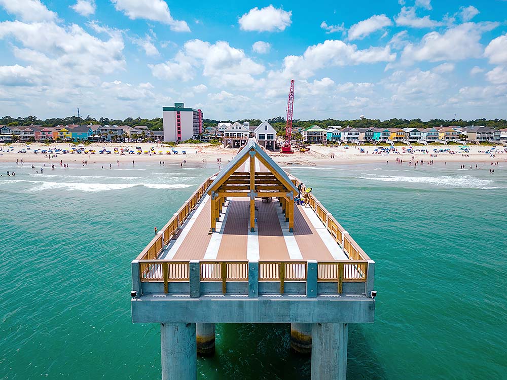 Fishing Pier and Tourists on the Beach in Surfside Beach, South Carolina
