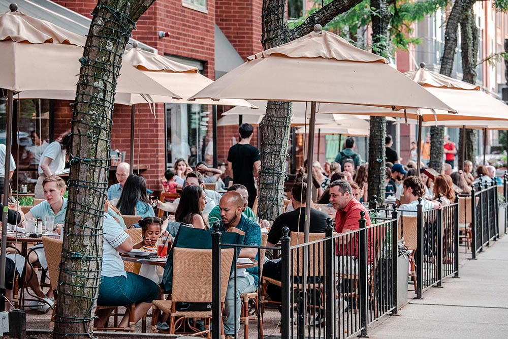 Restaurant eateries are a popular location on warm, sunny afternoons in Massachusetts.